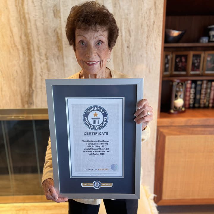 Dwan Young, 92, holds her official certificate recognizing her as the world record holder for oldest water skier (Courtesy: YESCO)