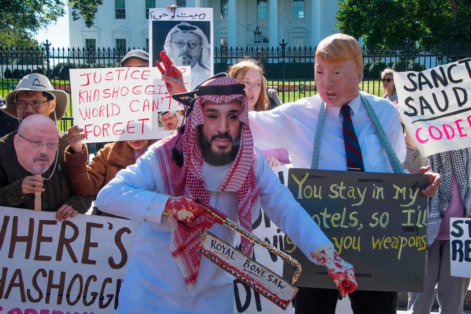 Demonstrators dressed as Saudi Crown Prince Mohammed bin Salman and President Donald Trump protest outside the White House on Oct. 19, 2018.