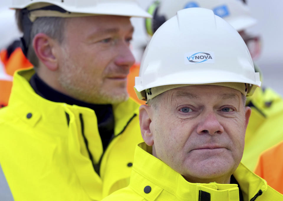 German Chancellor Olaf Scholz, front, and German Finance Minister Christian Lindner visit the 'Hoegh Esperanza' Floating Storage and Regasification Unit (FSRU) during the opening of the LNG (Liquefied Natural Gas) terminal in Wilhelmshaven, Germany, Saturday, Dec. 17, 2022. (AP Photo/Michael Sohn, Pool)