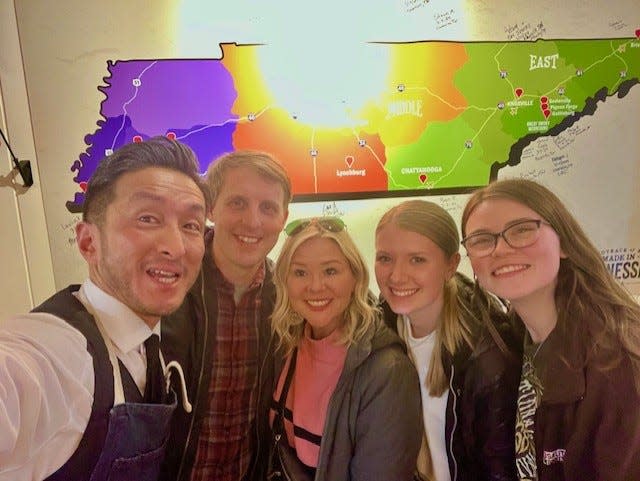 University of Tennessee alumnus Yoshitoshi Momoki, left to right, poses with Vols beat writer Adam Sparks, of Knox News, wife Bev Sparks and daughters Katelynn Jackson and Colby Sparks at Good Ole Tennessee Bar in Tokyo, Japan. Momoki, a UT alumnus, opened the Tennessee themed sports bar in February 2024.