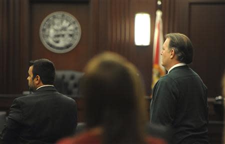 Michael Dunn (R), who faces first-degree murder charges in the death of 17-year-old Jordan Davis, stands with his attorney Cory Strolla (L) at Duval County Courthouse in Jacksonville, Florida February 6, 2014. REUTERS/Bob Mack/The Florida Times-Union/Handout
