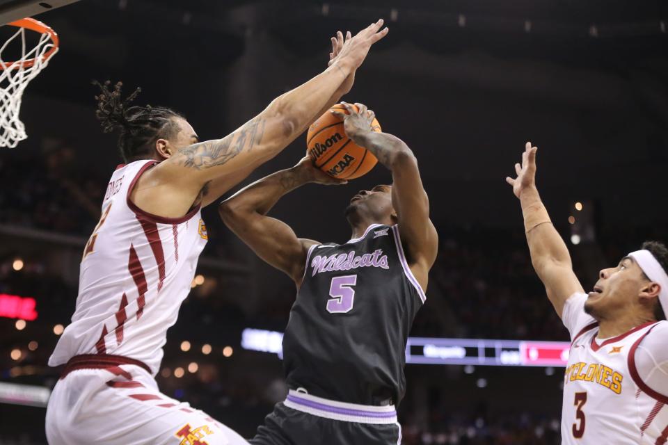 Kansas State guard Cam Carter (5) looks for a shot against Iowa State during the Big 12 Tournament last week in Kansas City, Mo. Carter, a junior, is entering the transfer portal after two seasons with the Wildcats.