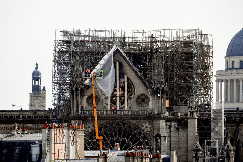 The cathedral's iconic steeple, and portions of its walls and roof, were destroyed in Monday's fire. (ALAIN JOCARD via Getty Images)