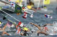 <p>Swimmers make their way through a feeding station during the women’s marathon swimming competition of the 2016 Summer Olympics in Rio de Janeiro, Brazil, Monday, Aug. 15, 2016. (AP Photo/Gregory Bull) </p>