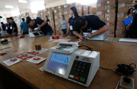 Brazilian electoral workers seal electronic ballot boxes in Brasilia, Brazil September 19, 2018. REUTERS/Adriano Machado