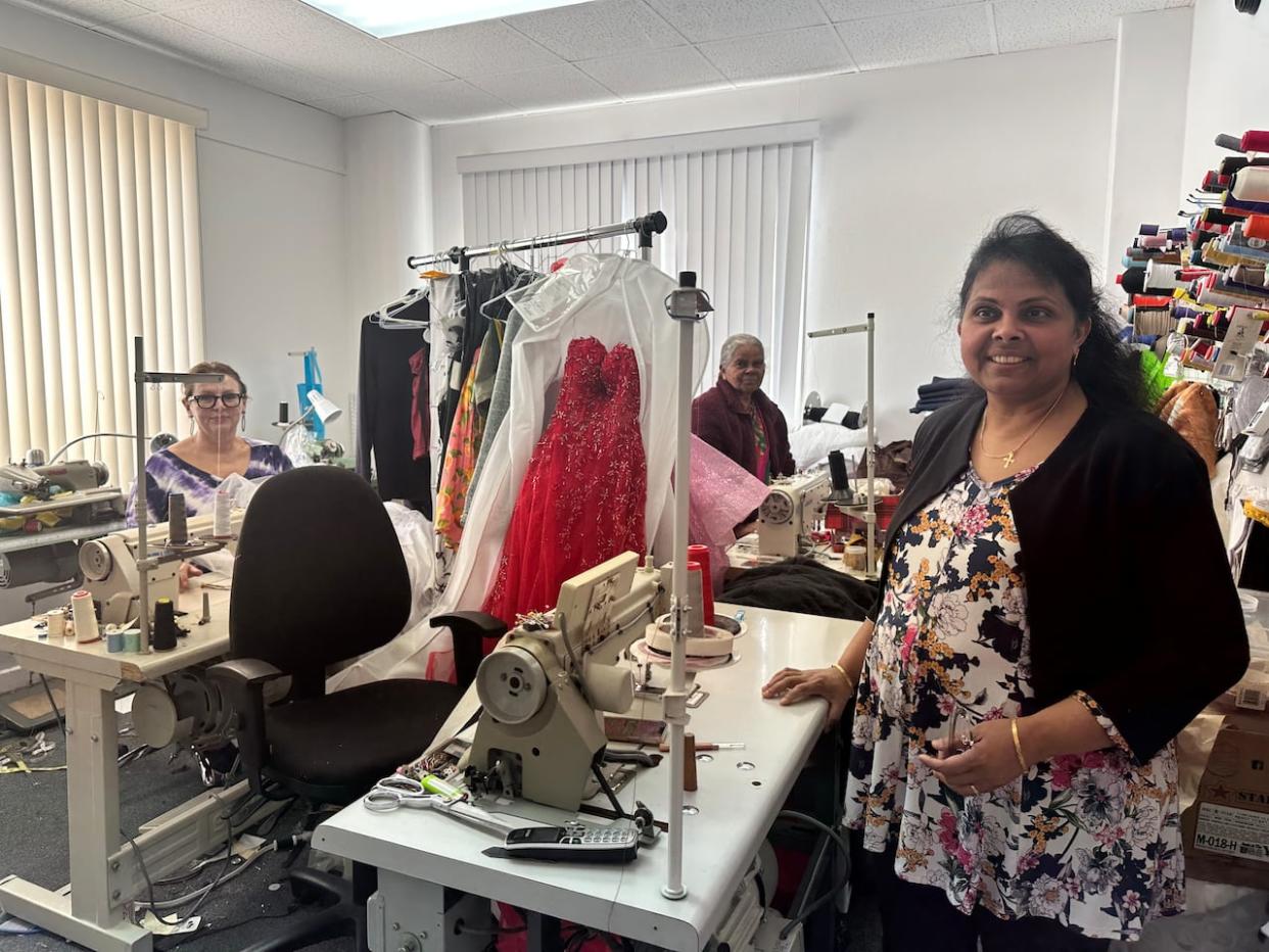 Viggila Goldwin opened her sewing business 10 years ago by herself. Now, she has help from her mother, Lizzie Charles, and an employee, Irina Biricheva. (Prapti Bamaniya/ CBC - image credit)