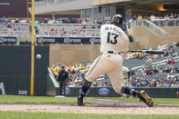Minnesota Twins' Manuel Margot hits a double driving in three runs against Seattle Mariners Logan Gilbert during the first inning of a baseball game, Thursday, May 9, 2024, in Minneapolis. (AP Photo/Craig Lassig)