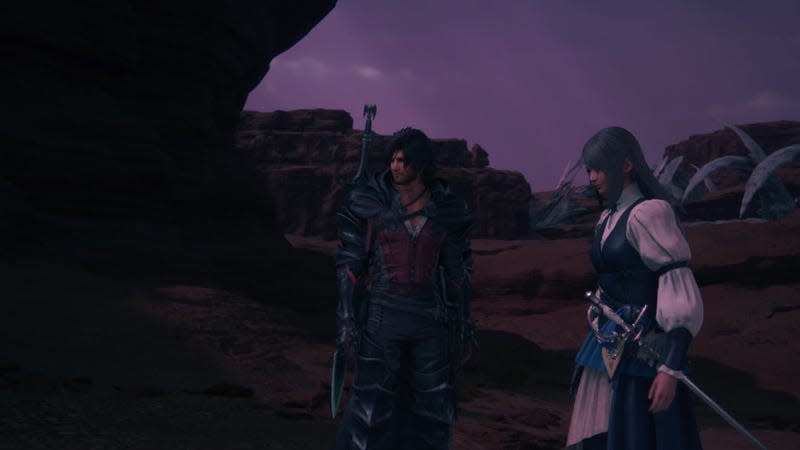 Clive and Jill stand in a dimly lit desert.