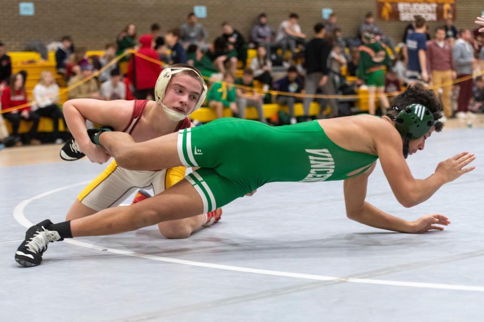 Mater Dei’s Caleb Schaefer and Vincennes Lincoln’s Donta Henderson compete in the 113-pound championship match of the 2024 IHSAA Wrestling Sectional tournament at Central High School in Evansville, Ind., Saturday afternoon, Jan. 27, 2024.