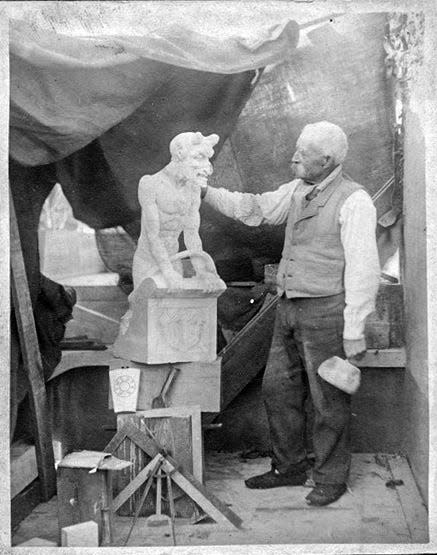 Herman Menz with his devil. Menz placed the sculpture on a stone base, reaching a height of 14 feet.  