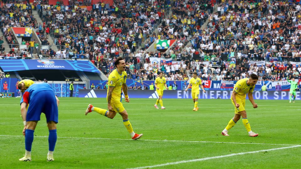 Ukraine's Mykola Shaparenko celebrates scoring his side's equalizing goal. - Bernadett Szabo/Reuters