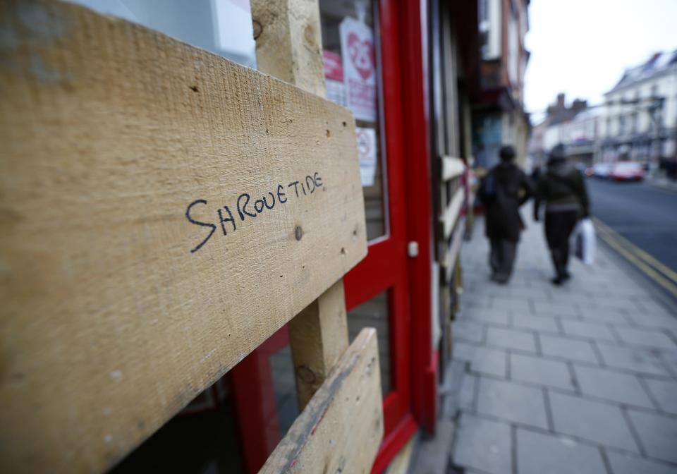 <p>�A boarded shop in Ashbourne before the annual football game (Reuters)</p>