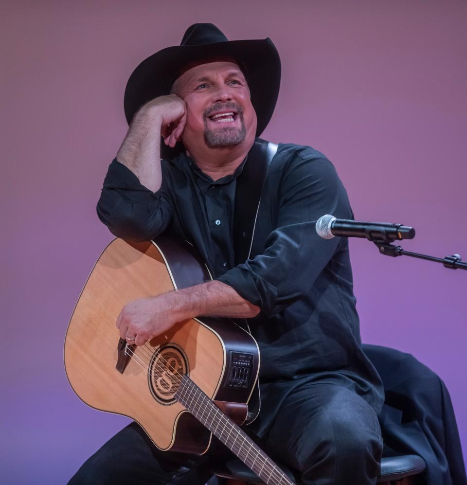 Garth Brooks speaks and performs songs during a Q&A with Alice Randall regarding Charley Pride at the National Museum of African American Music Monday, October 25, 2021.