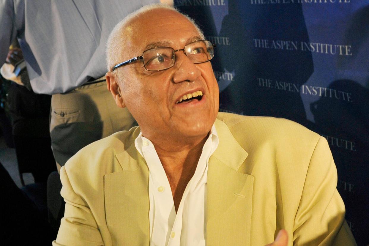 Clifford Alexander, Jr., foreground, greets an attendee after a dialogue featuring poet Elizabeth Alexander, upper left background, September, 24, 2010 in Washington, DC.