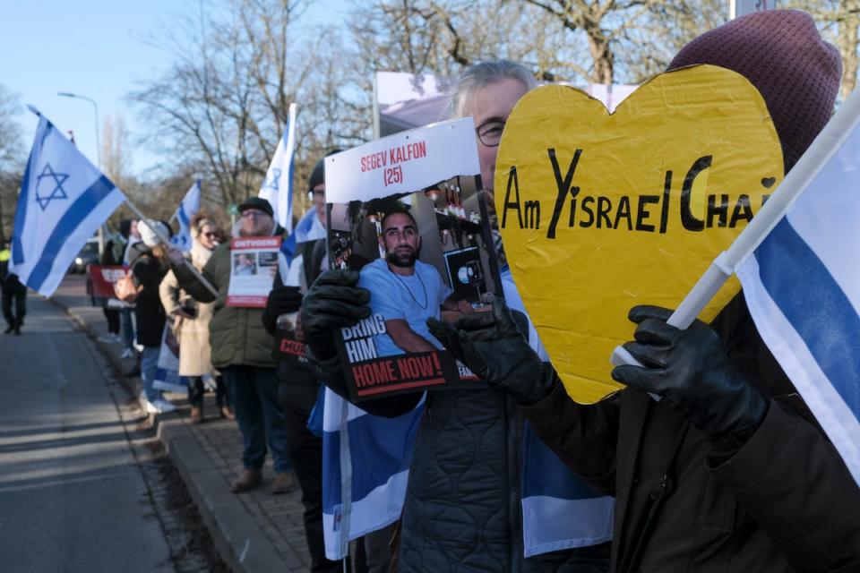 Pro-Israel activists gather near the International Court of Justice in The Hague (AP)