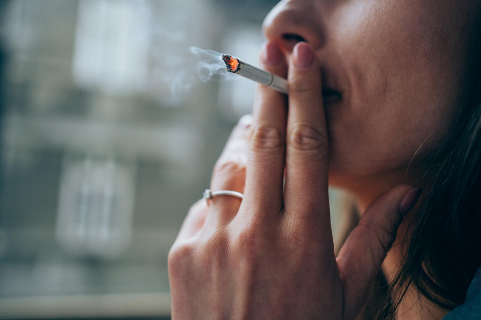 a woman smoking a cigarette