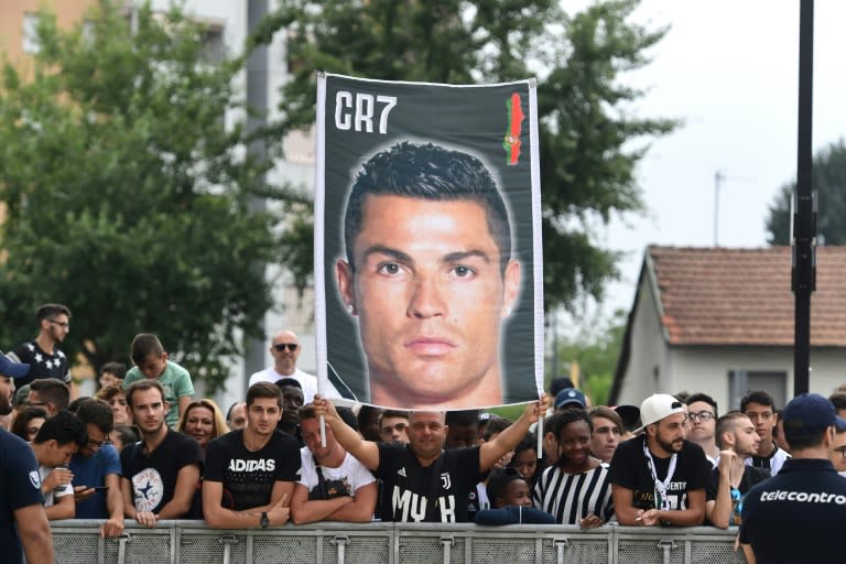 Juventus fans gathered outside the club's medical centre to greet Cristiano Ronaldo