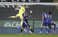 Newcastle's Paul Dummett, left, scores his team's second goal during the English Premier League soccer match between Leicester City and Newcastle United at the King Power Stadium in Leicester, England, Friday, May 7, 2021. (Nick Potts/Pool via AP)