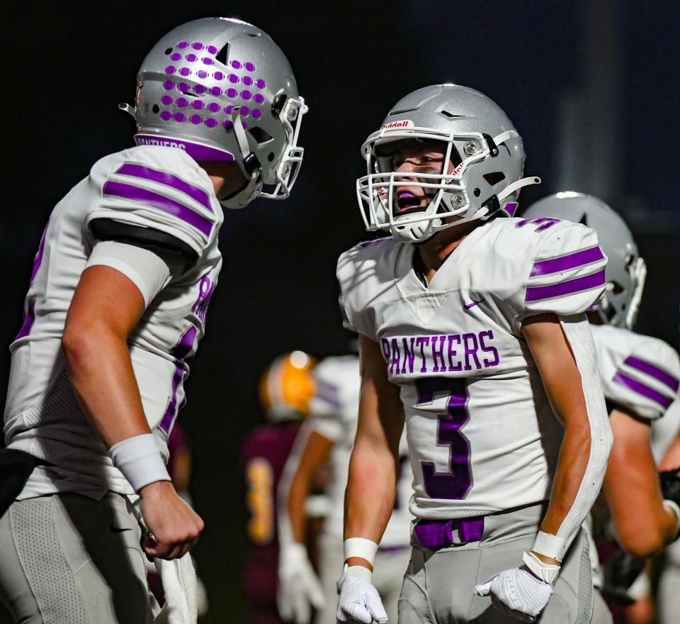 Bloomington South’s Jarrin Alley (left) celebrates with Lucas Waldon (3) after a touchdown by Waldon during the IHSAA sectional semi-final football game at Bloomington North on Friday, Oct. 27, 2023.