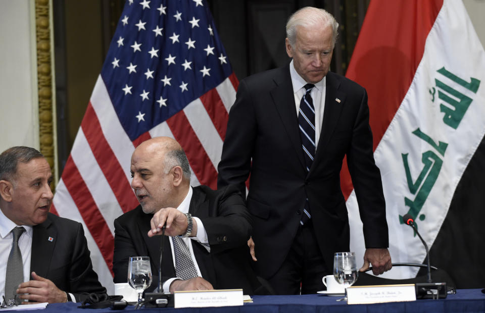 Biden arriving at an event with then-Iraqi Prime Minister Haider al-Abadi (second from left), whom the U.S. scrambled to help form a government after Maliki's controversial reign. (Photo: ASSOCIATED PRESS)