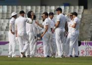 Cricket - Bangladesh v England - Second Test cricket match - Sher-e-Bangla Stadium, Dhaka, Bangladesh - 29/10/16. England's Zafar Ansari (C) celebrates with his teammates after taking the wicket of Bangladesh's Tamim Iqbal. REUTERS/Mohammad Ponir Hossain