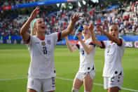 (L-R) Julie Ertz, Rose Lavelle and Mallory Pugh of the USA celebrate victory after the 2019 FIFA Women's World Cup France Round Of 16 match between Spain and USA at Stade Auguste Delaune on June 24, 2019 in Reims, France. (Photo by Marc Atkins/Getty Images)