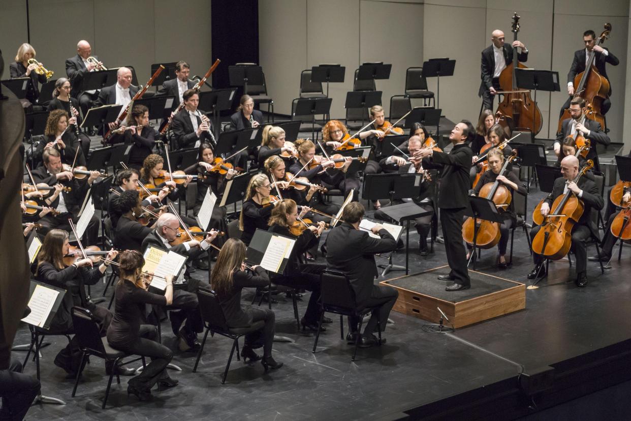 Music director Ken Lam conducts the Illinois Symphony Orchestra.