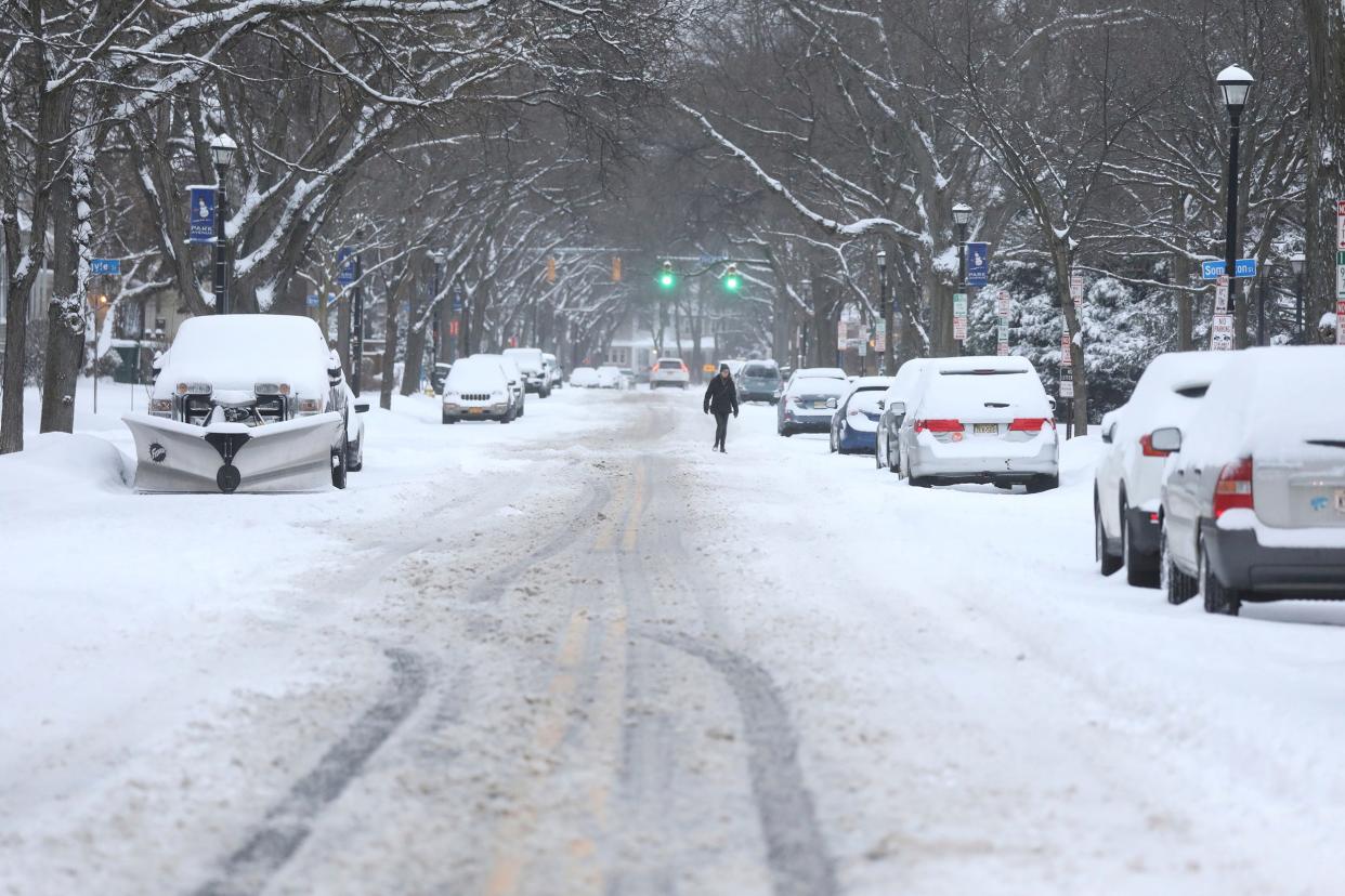 Snow covers the street in Rochester, N.Y., on Friday, Feb. 25, 2022. Residents across the Northeast awoke to a steady snow that could bring a foot or more of accumulation to many areas, and a sloppy mix of sleet and ice to other spots.