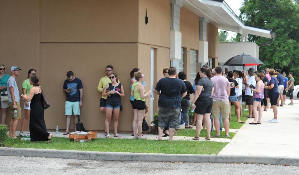 <p>Potential blood donors line up outside the oneblood facility on Beach Blvd. In Jacksonville, Fla., June 12, 2016, to help the victims from the shooting at a nightclub in Orlando. (Bob Self/The Florida Times-Union via AP) </p>