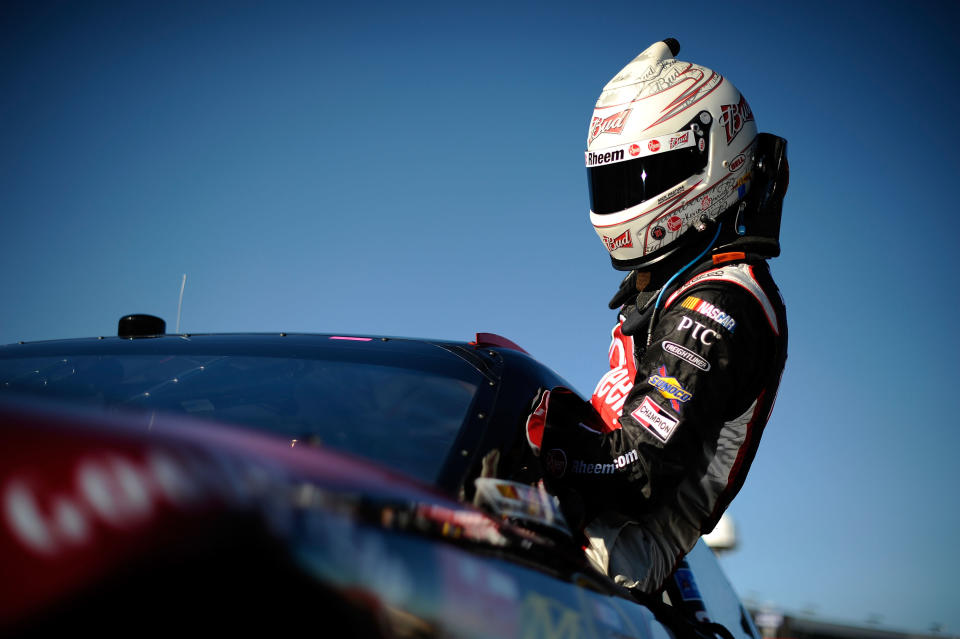 FORT WORTH, TX - NOVEMBER 04: Kevin Harvick, driver of the #29 Rheem Chevrolet, climbs from his car after qualifying for the NASCAR Sprint Cup Series AAA Texas 500 at Texas Motor Speedway on November 4, 2011 in Fort Worth, Texas. (Photo by Jared C. Tilton/Getty Images for NASCAR)