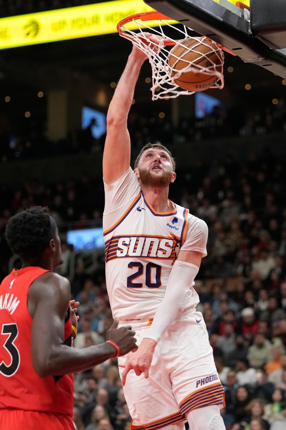 Phoenix Suns center Jusuf Nurkic (20) makes a basket as Toronto Raptors forward Pascal Siakam (43) looks on during the first half at Scotiabank Arena in Toronto on Nov. 29, 2023. Mandatory Credit: John E. Sokolowski-USA TODAY Sports