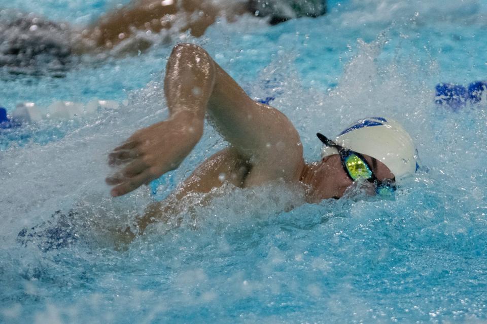 Pueblo Central’s Ben Studen competes in the 50 freestyle event during a dual with Pueblo County on Tuesday, April 12, 2022.