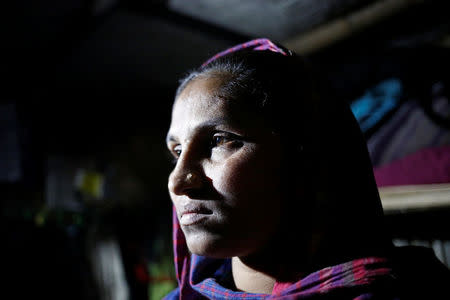 Rohingya Muslim refugee Sanmaraz, whose husband is in prison on charges of carrying ya ba, poses for a picture inside her room in the Leda Unregistered Refugee Camp, in Teknaf, Bangladesh, February 15, 2017. Picture taken February 15, 2017. REUTERS/Mohammad Ponir Hossain