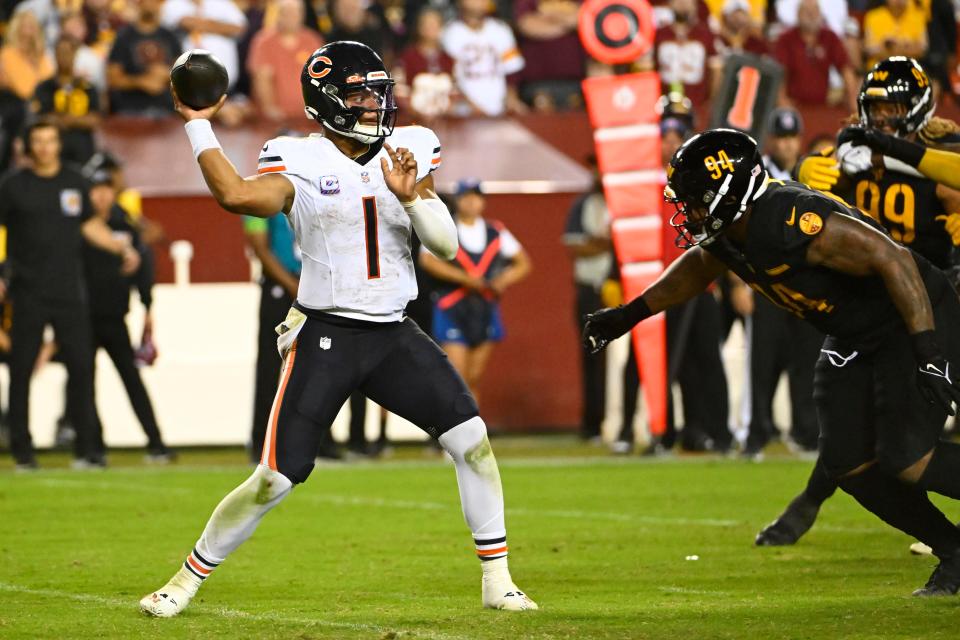 Chicago Bears quarterback Justin Fields throws over Washington Commanders defensive tackle Daron Payne during the second half at FedExField.