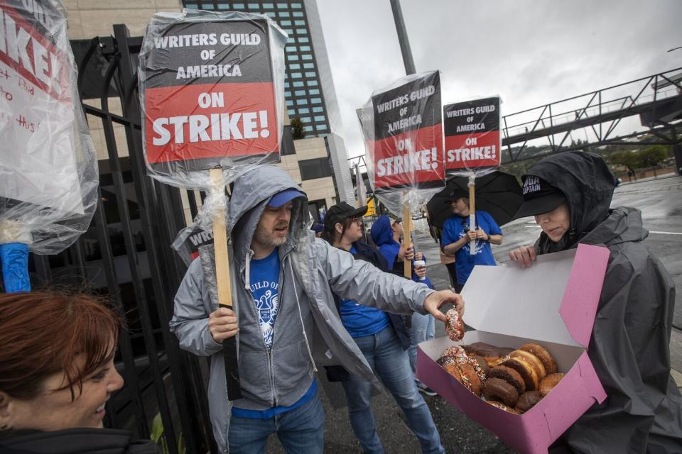 Members of the Writers Guild of America strike outside of NBCUniversal offices in Universal City.