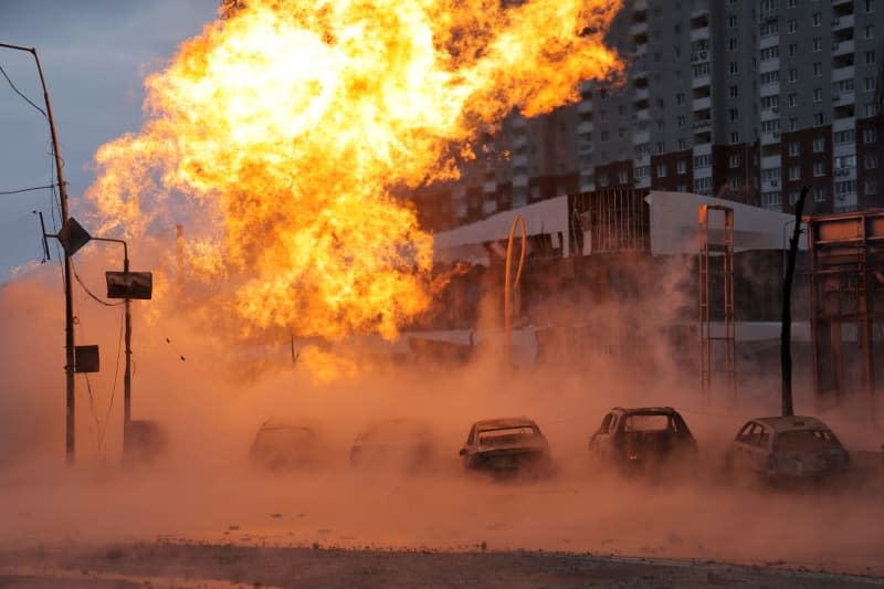 A fire caused by falling rocket debris rages at a pipeline in the Podilskyi district after the Russian missile attack. -/https://photonew.ukrinform.com/ Ukrinform/dpa