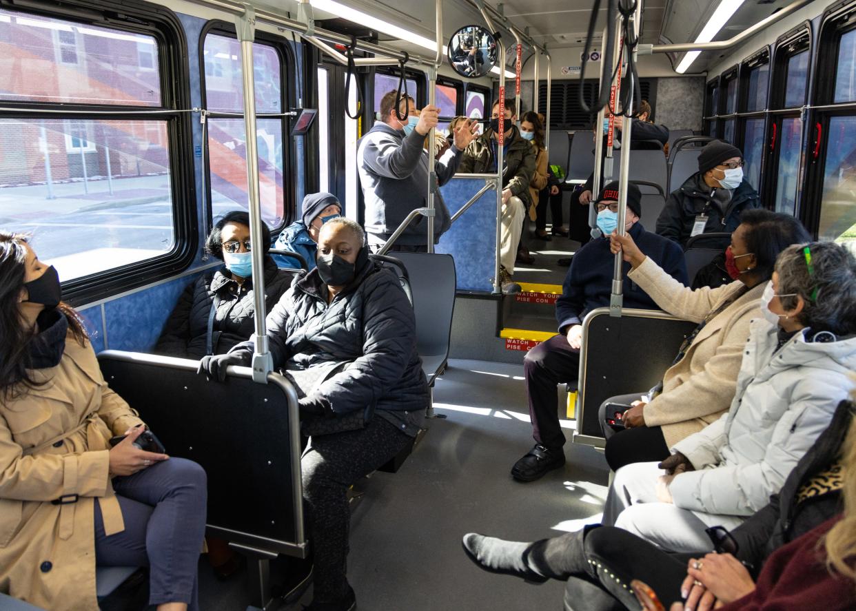 People ride one of Metro RTA's new electric buses on Tuesday, March 29, 2022, in Akron, Ohio.