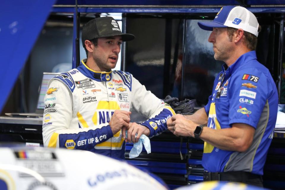 LEBANON, TENNESSEE - JUNE 23: Chase Elliott, driver of the #9 NAPA Auto Parts Chevrolet, (L) and crew chief Alan Gustafson talk in the garage area during practice for the NASCAR Cup Series Ally 400 at Nashville Superspeedway on June 23, 2023 in Lebanon, Tennessee. (Photo by Meg Oliphant/Getty Images)