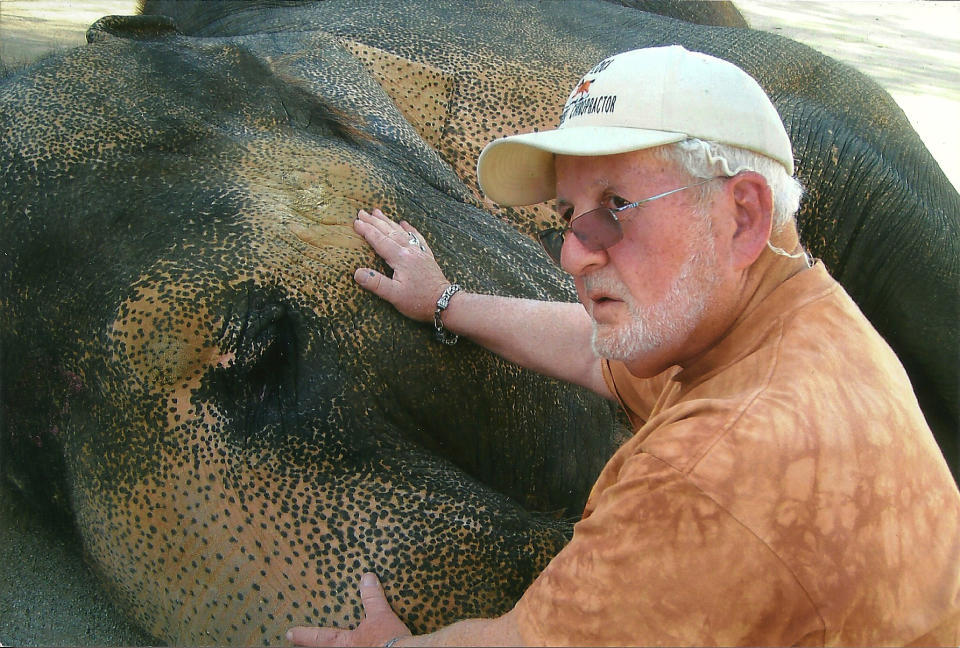 A 2012 photo provided by Dr. Rod Block shows Block working with an elephant, checking its breathing, at the Meadowbrook Animal Sanctuary and Haven in Perris, Calif. "You have to be very much in tune with the being of the animal you are working with," said Dr. Block, who limits his work these days to house calls throughout Southern California, where he works with several veterinarians. (AP Photo/Dr. Rod Block)