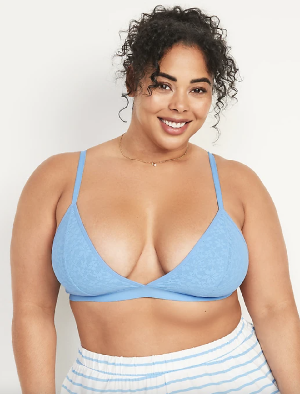 plus size model in blue bra and PJ shorts, Floral Signature Mesh Bralette (Photo via Old Navy)