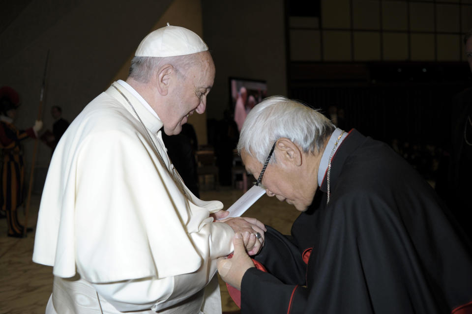 FILE -- In this Jan. 10, 2018 file photo made available the Vatican newspaper L'Osservatore Romano, retired archbishop of Hong Kong Cardinal Joseph Zen greets Pope Francis at the end of his weekly general audience in Paul VI, at the Vatican. The Vatican on Tuesday, Sept. 29, 2020, answered its critics and justified its decision to pursue an extension of an agreement with China over bishop nominations, acknowledging difficulties but insisting that limited, positive results had been achieved. (L'Osservatore Romano/Pool Photo via AP)