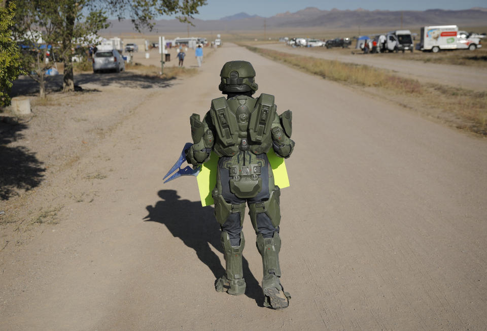 A man in costume walks around an event at the Little A'Le'Inn inspired by the "Storm Area 51" internet hoax, Sept. 21, 2019, in Rachel, Nev. (Photo: John Locher/AP)