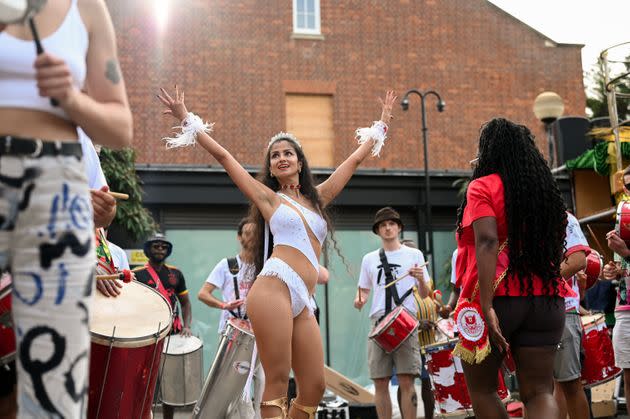 Amelia Karlsen, this year's Rainha, or Queen, for the Paraiso School of Samba, rehearses ahead of this year's Notting Hill Carnival parade. Paraiso School of Samba will open this year's parade and be the first to walk and dance down the streets of Notting Hill on Carnival Monday. (Photo: Clara Watt for HuffPost)