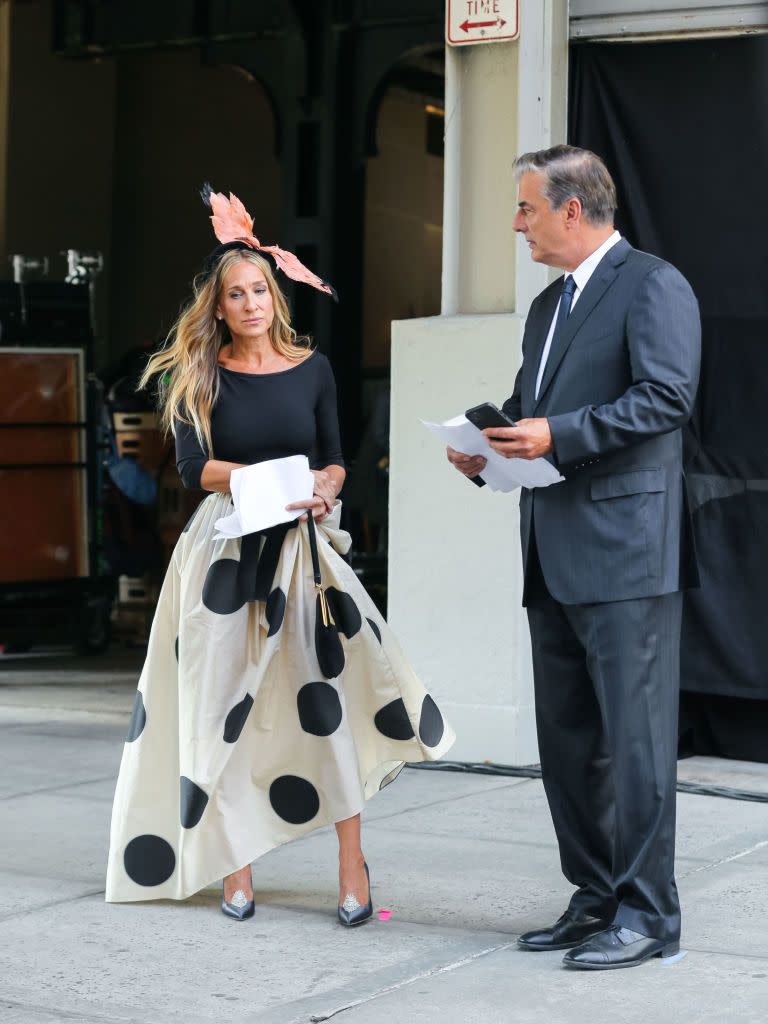 <p>The reunion that half the fans of SATC wanted and half did not. While, according to rumours, their marriage might be on the rocks, we have to give it to the will-they-won't-they couple that the style credentials for these two are not rocky.</p><p>SJP was looking very Carrie-esque in an extravagant feather headdress, a bodice by capezio, a Carolina Hererra oversize polka dot skirt and Duchessa Gardini shoes according to <a href="https://www.instagram.com/p/CSFGFBFIYsb/" rel="nofollow noopener" target="_blank" data-ylk="slk:@justlikethatcloset.;elm:context_link;itc:0;sec:content-canvas" class="link ">@justlikethatcloset.</a> Mr Big was suited and booted as ever.</p><p><a class="link " href="https://www.net-a-porter.com/en-gb/shop/product/carolina-herrera/clothing/midi/tiered-polka-dot-silk-midi-skirt/25458910981946198" rel="nofollow noopener" target="_blank" data-ylk="slk:SHOP SIMILAR;elm:context_link;itc:0;sec:content-canvas">SHOP SIMILAR </a>Carolina Herrera tiered polka-dot midi skirt, £1,300<br></p>