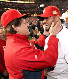 Manager Tony La Russa and Albert Pujols celebrate after defeating the Texas Rangers 6-2 to win the World Series in Game 7