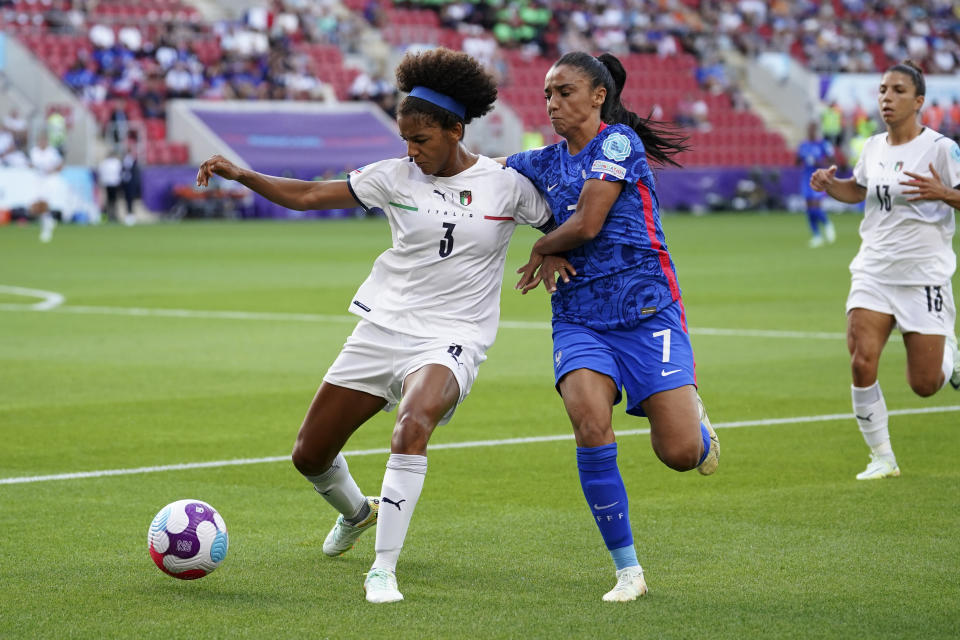 FILE - France's Sakina Karchaoui fights for the ball with Italy's Sara Gama, left, during the Women Euro 2022 group D soccer match between France and Italy at New York Stadium in Rotherham, England, on July 10, 2022. Longtime captain Sara Gama was left off Italy’s squad for the Women’s World Cup purely “for technical-tactical and physical” reasons, coach Milena Bertolini said Monday. Gama was a surprising omission when Bertolini announced a preliminary 32-woman team for the July 20-Aug. 20 tournament in Australia and New Zealand. (AP Photo/Dave Thompson, File)