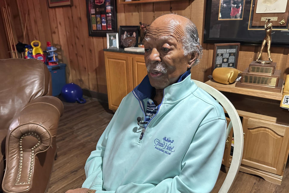 Gregory Eaton sits in a chair during an interview at his home, Tuesday, Jan. 30, 2024 in Lansing, Mich. Eaton is a member of the exclusive "never missed a Super Bowl" club. He and two friends, all in their 80s, plan to be in Las Vegas on Sunday for Super Bowl 58. (AP Photo/Mike Householder)