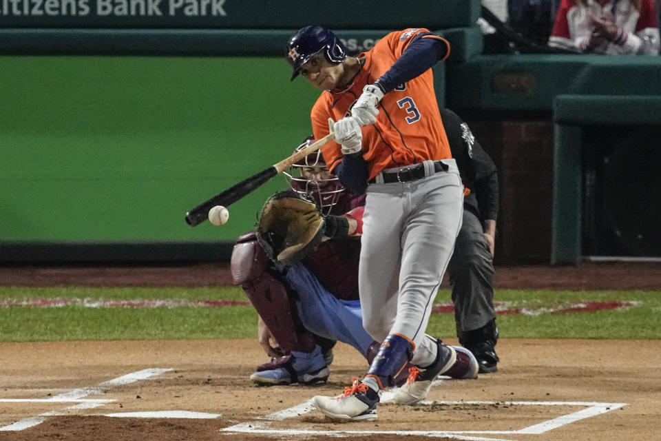 Houston Astros' Jeremy Pena hits an RBI single during the first inning in Game 5 of baseball's World Series between the Houston Astros and the Philadelphia Phillies on Thursday, Nov. 3, 2022, in Philadelphia. (AP Photo/Matt Rourke)