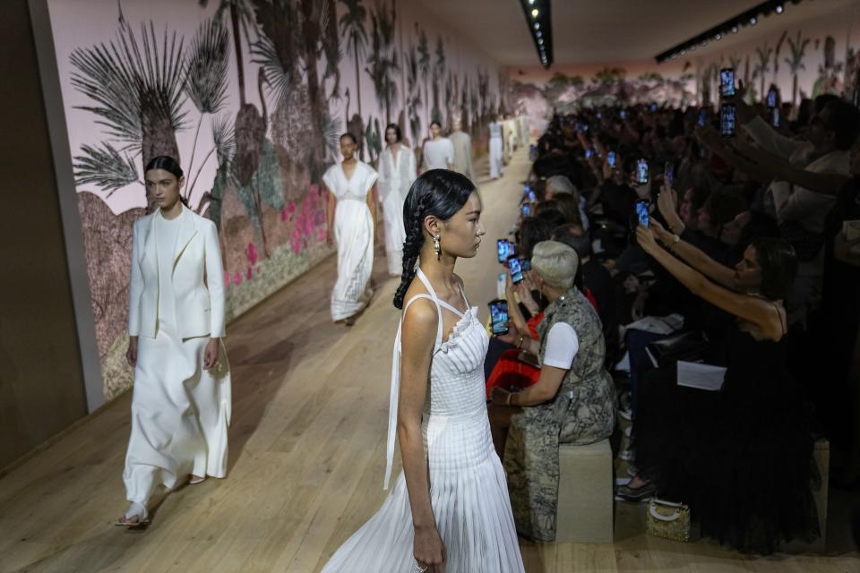 Models wear creations for the Christian Dior Haute Couture Fall/Winter 2023-2024 fashion collection presented in Paris, Monday, July 3, 2023. (AP Photo/Michel Euler)
