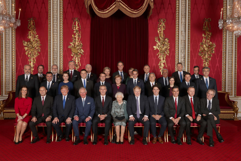 Leaders of NATO alliance countries, and its secretary general, join Britain's Queen Elizabeth and the Prince of Wales for a group picture during the reception.&nbsp; (Photo: POOL New / Reuters)